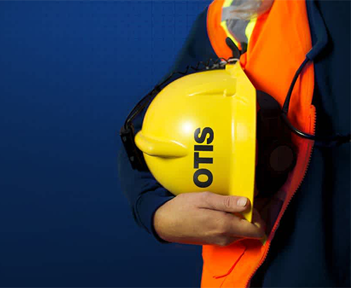 person holding otis helmet